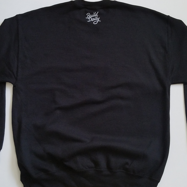 Back of black crewneck sweatshirt with white build daily signature logo