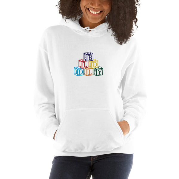 Woman wearing white hooded sweatshirt with build daily building blocks design