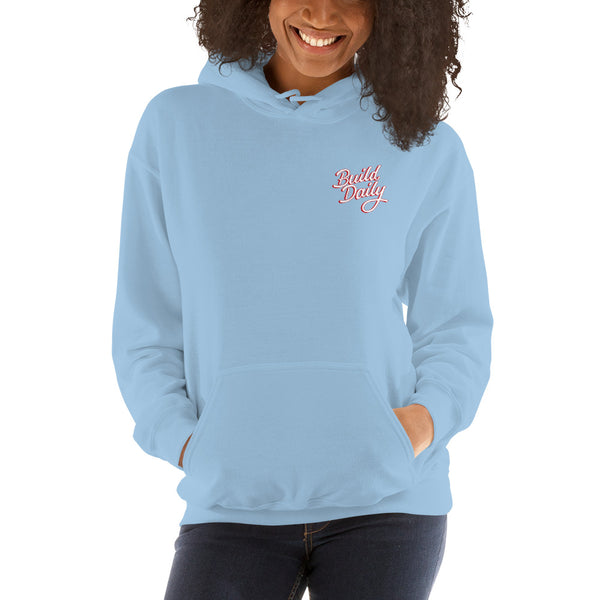Woman wearing light blue hooded sweatshirt with white and red build daily signature logo