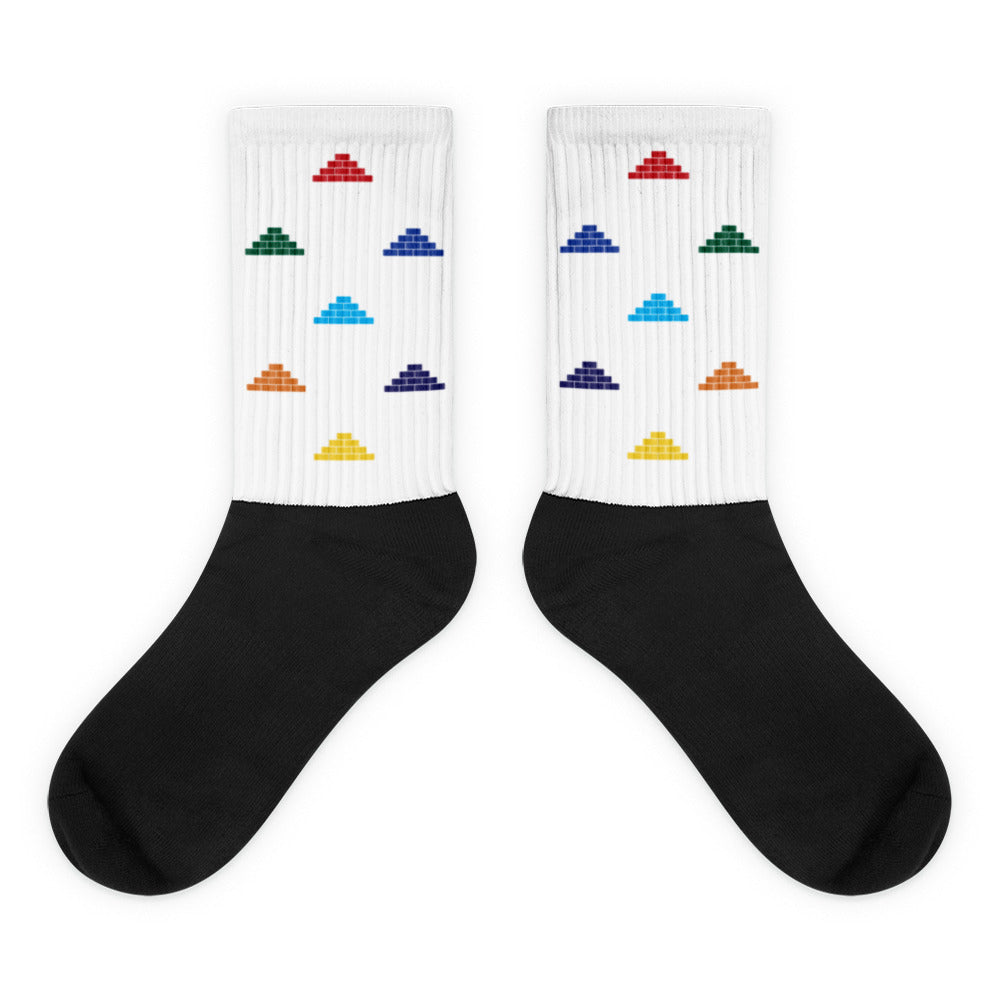 White and black socks with multi color build daily brick by brick logo