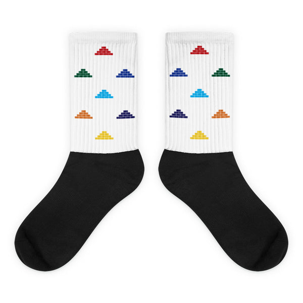 White and black socks with multi color build daily brick by brick logo