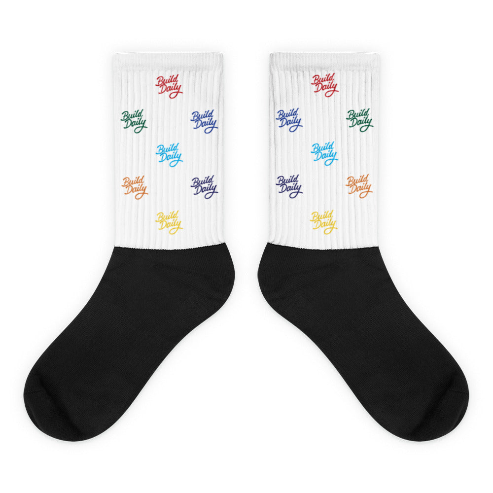 White and black socks with multi color build daily signature logo