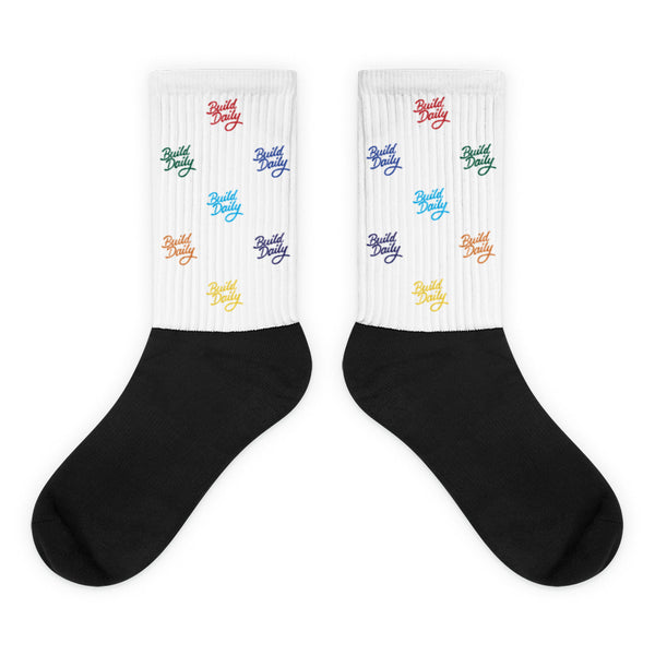 White and black socks with multi color build daily signature logo