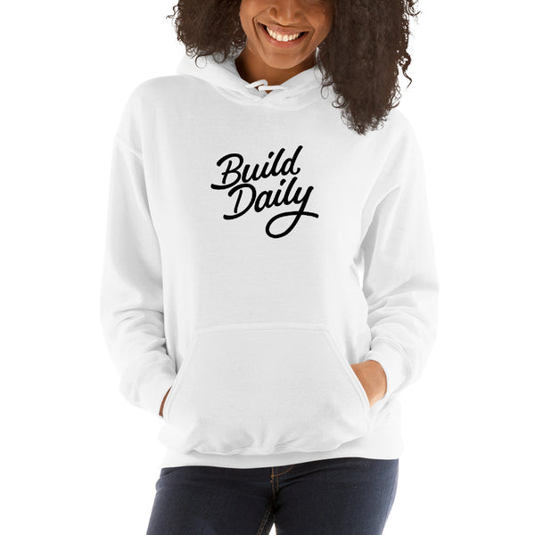 Woman wearing white hooded sweatshirt with black build daily signature logo