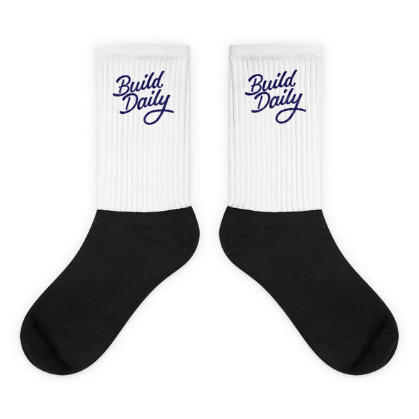 White and black socks with navy blue build daily signature logo