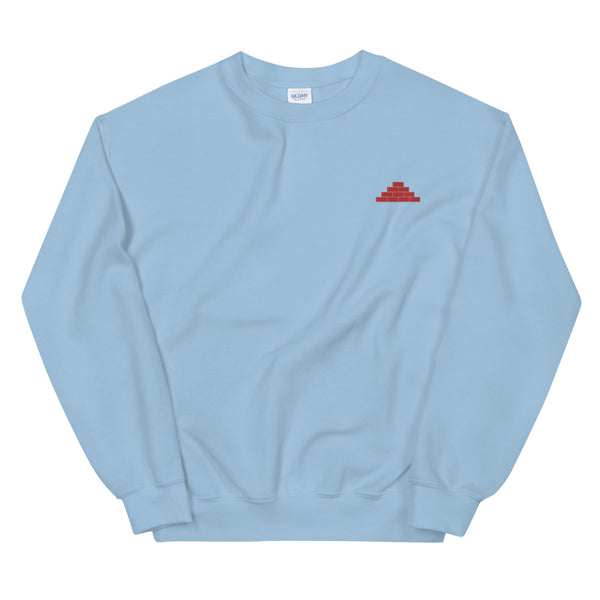 Light blue crewneck sweatshirt with red build daily brick by brick logo
