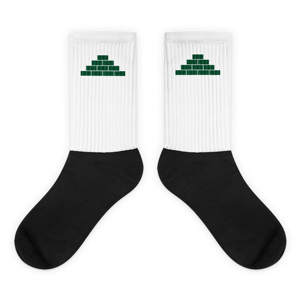 White and black socks with green build daily brick by brick logo
