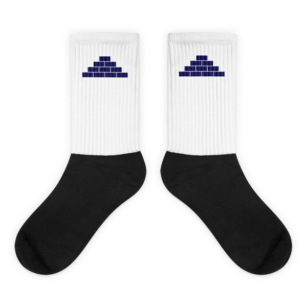 White and black socks with navy blue build daily brick by brick logo