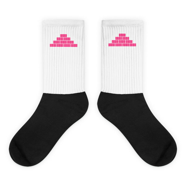 White and black socks with pink build daily brick by brick logo