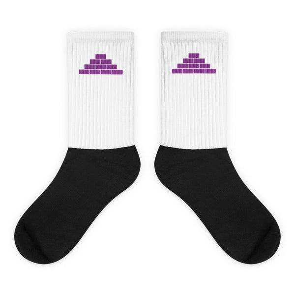 White and black socks with purple build daily brick by brick logo