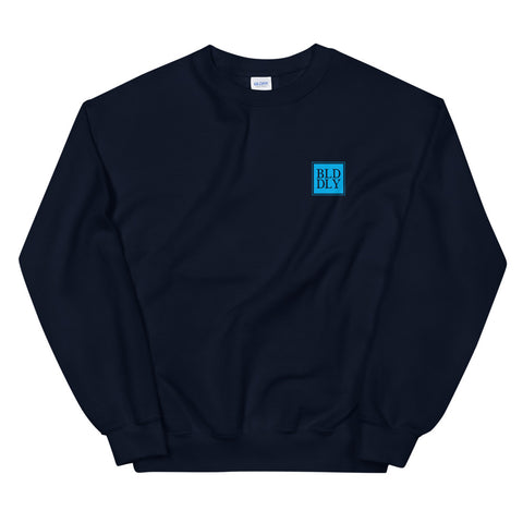 Navy blue crewneck sweatshirt with light blue build daily monogram logo