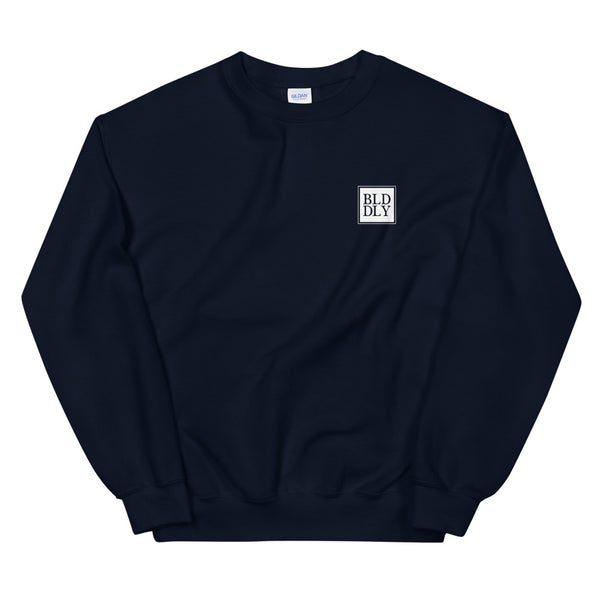 Navy blue crewneck sweatshirt with white build daily monogram logo