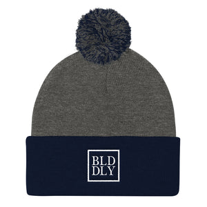 Grey and navy blue beanie with white build daily monogram logo