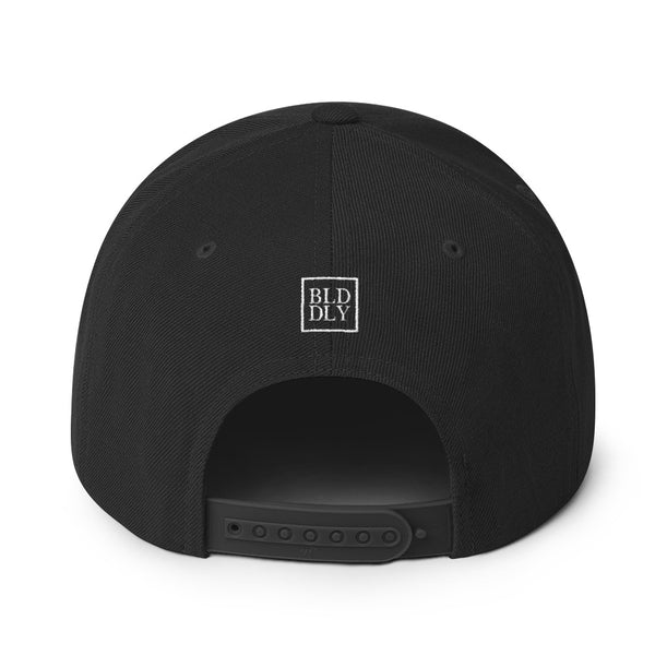 Back of black cap with white build daily monogram logo