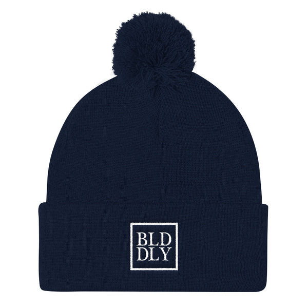 Navy blue beanie with white build daily monogram logo