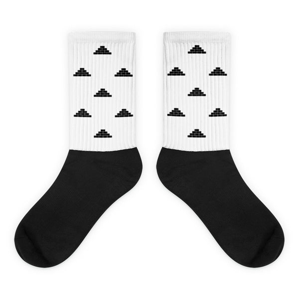 White and black socks with black build daily brick by brick logo