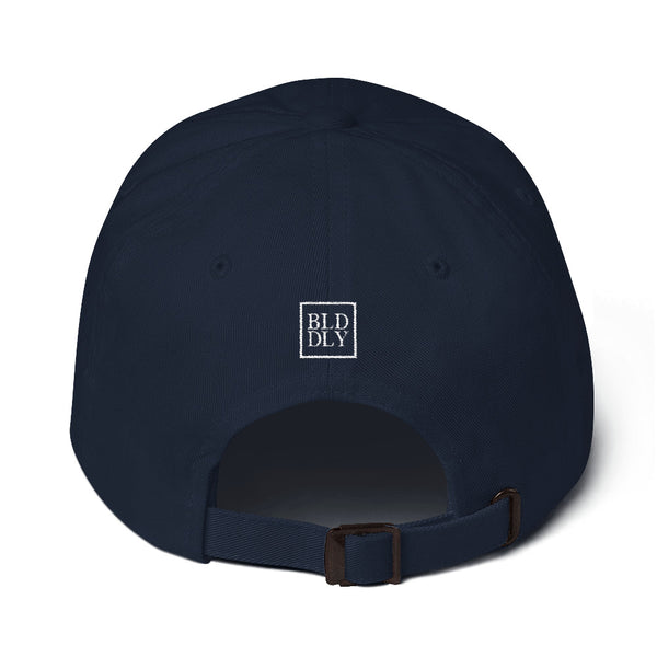 Back of navy blue cap with white build daily monogram logo