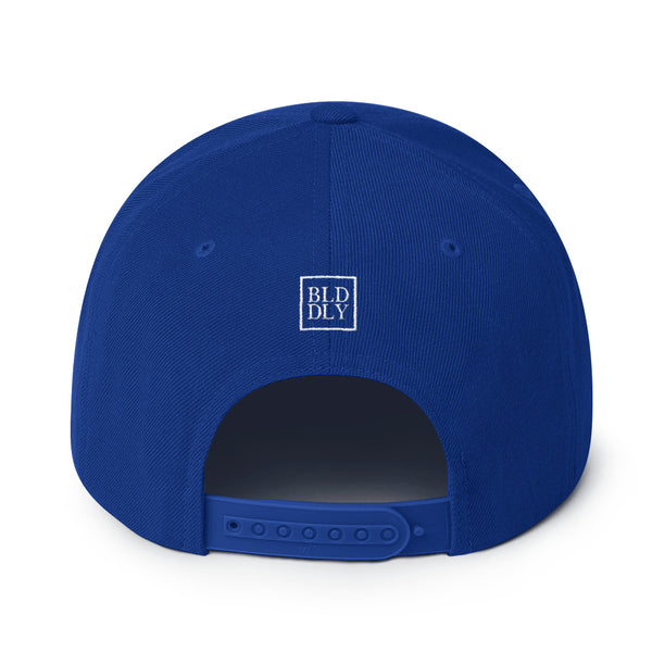 Back of royal blue cap with white build daily monogram logo