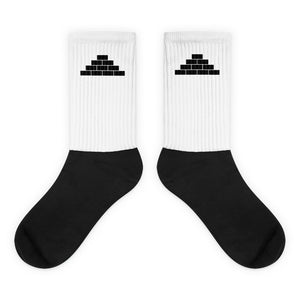 White and black socks with black build daily brick by brick logo