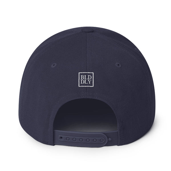 Back of navy blue cap with white build daily monogram logo