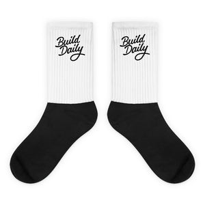 White and black socks with black build daily signature logo