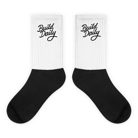 White and black socks with black build daily signature logo